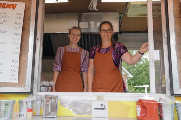 Left - right, Esther Krahn, Suzanna Harder, Food Truck at Countryside Summer Market, Froese Vegetables, signed 3